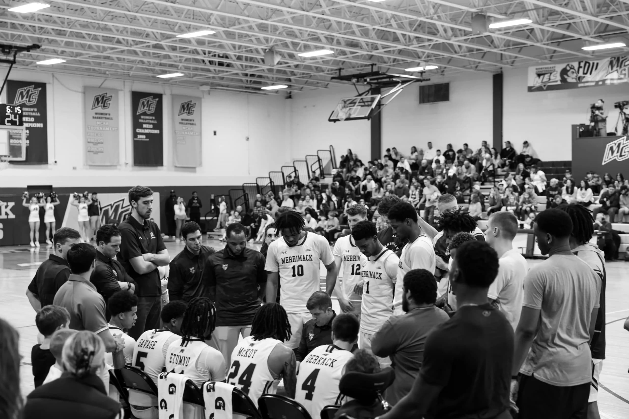 Merrimack basketball team huddle