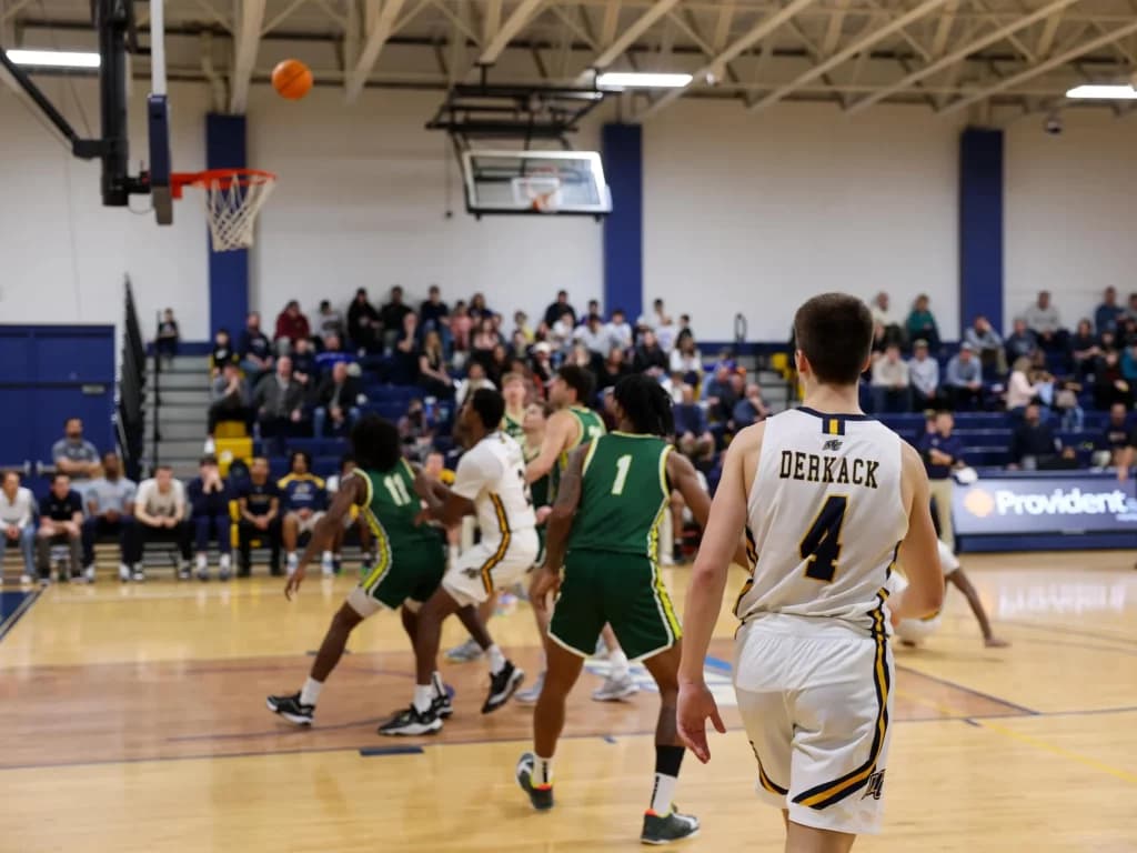 Merrimack basketball player at a Go Mack event