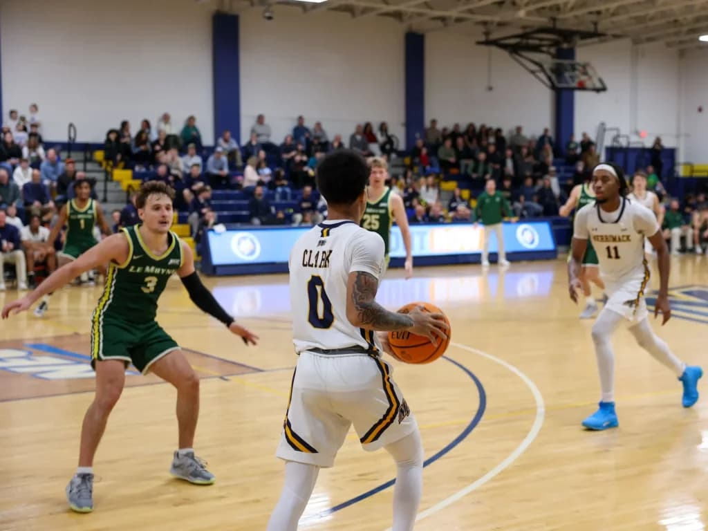 Merrimack basketball player smiling at an event
